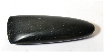 Lot 458 - A Highlands Black Stone Axe Head, Papua New Guinea, of typical form, 24cm by 8cm