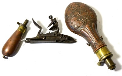 Lot 475 - A Copper Powder Flask, embossed with leaves and fluting, the brass charger with internal...