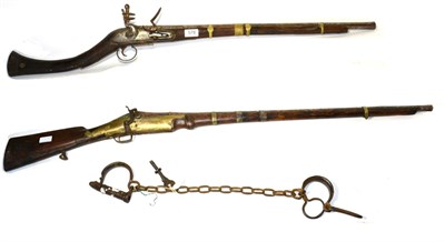 Lot 578 - A 19th Century Indian Flintlock Carbine, with 66.5cm swamped steel barrel chiselled with...