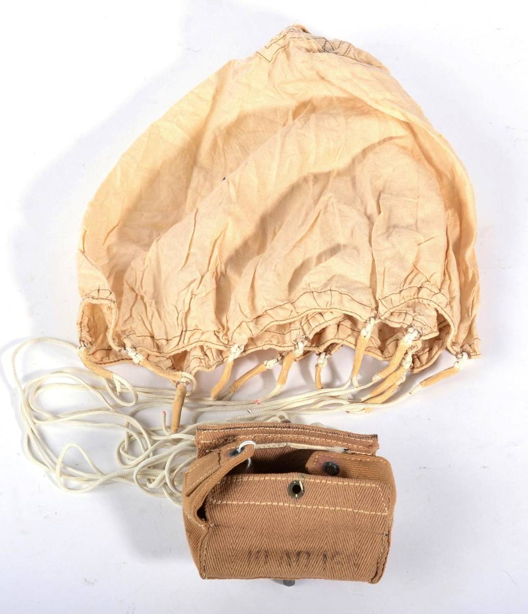 Lot 67 - A Rare Pigeon Parachute, with cream cloth canopy, herringbone weave canvas pouch with aluminium...