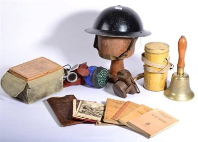 Lot 85 - An Assortment of Second World War Memorabilia, including a black-enamelled Brodie helmet, inscribed