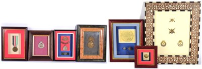 Lot 87 - Militaria in Seven Glazed Displays, containing:- Australian Peace Medallion 1919 with shoulder...
