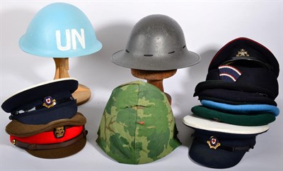 Lot 119 - A Collection of Late 20th Century Military Headgear, comprising three helmets, four peaked caps and