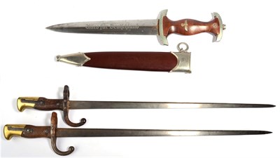 Lot 126 - A German Third Reich SA dagger, the steel blade etched, ";Alles fur Deutschland";, the ricasso with