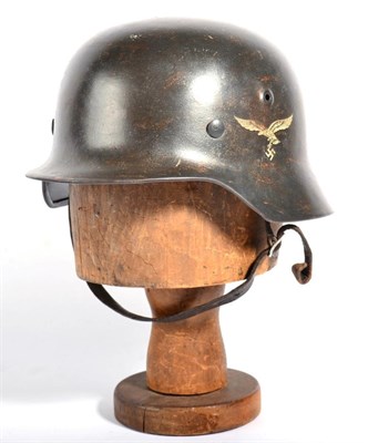 Lot 127 - A German Third Reich M1940 Single Decal Luftwaffe Helmet, with grey/blue paint, rolled edge,...