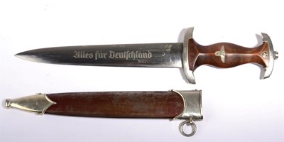 Lot 151 - A German Third Reich SA Dagger, the double edge steel blade etched Alles fur Deutschland and...