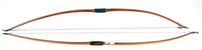 Lot 177 - A Late 19th Century Yew Wood Self Bow by Buchanan, Piccadilly, with horn nocks, blue velvet covered