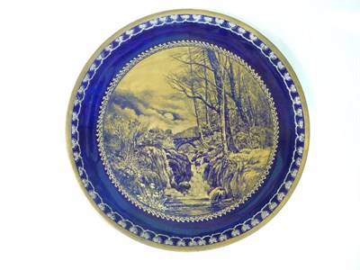 Lot 112 - A Staffordshire Pottery Plate, late 19th century, gilt by A Lanthe with a moonlit river...