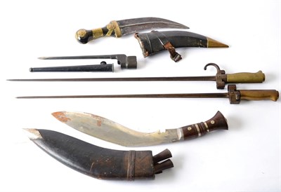 Lot 201 - A Nepalese Kukri, with unmarked curved steel blade, wood grip with nickel mounts and pommel, in...