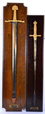 Lot 204 - Two Replica French Swords, each with gilt metal cruciform hilt, one mounted on an oak display board