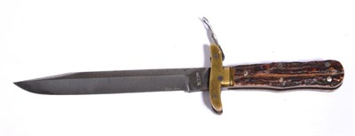 Lot 222 - A Folding Bowie Knife, the clip point blade stamped, ";M. I. Ltd.";  to the ricasso, brass...