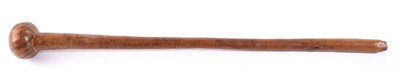 Lot 271 - A Zulu Knobkerrie, of light hard wood, the globular head with shallow wrythen carved...