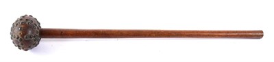 Lot 273 - A Zulu Knobkerrie, of honey coloured hard wood, the large globular head studded with brass...