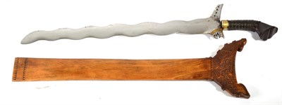 Lot 280 - A Mid/Late 20th Century Moro Kris, with twelve lok polished steel blade, the lacquered wood...