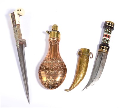 Lot 286 - An Indian Pesh-Kabz, with 18cm straight T section steel blade, white metal hilt with foliate...