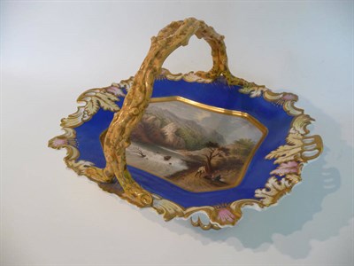 Lot 123 - A Chamberlains Worcester Porcelain Basket, circa 1830, with overhead twig handle, painted with...