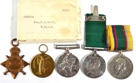 Lot 7 - A Group of Three Medals, comprising a Volunteer Long Service Medal (Edward VII), awarded to...