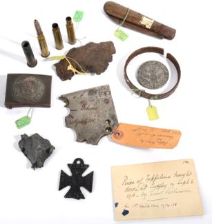 Lot 136 - A Small Collection of First World War Items, including a German steel belt buckle, a folding pocket