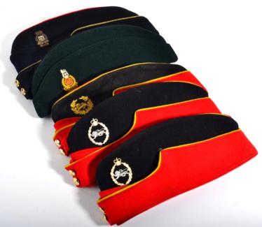 Lot 198 - Three Torin Caps to the King's Own Royal Border Regiment, one with embroidered insignia, two...