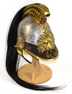 Lot 206 - A 19th Century Belgian OR's Cuirassier's Helmet, the steel skull surmounted by a fluted brass...