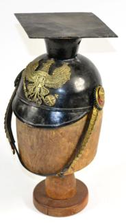 Lot 211 - A Prussian Enlisted Man's All Steel Tschapka, black enamelled, with square top, brass helmet plate