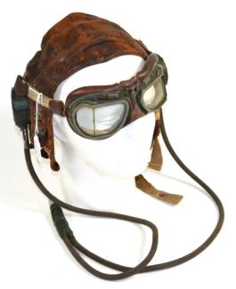 Lot 215 - A Second World War RAF Type C Leather Flying Helmet, lined in chamois leather, the earphones...