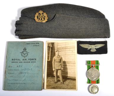 Lot 220 - A Second World War RAF Side Cap, with brass cap badge and black horn buttons, a pair of printed...