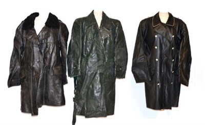 Lot 241 - A German Navy Black Leather Double Breasted Coat, with astrakan collar and grey wool lining; a...