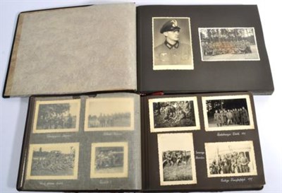 Lot 259 - A German Third Reich Period Photograph Album, the cover relief with a white metal German Army...