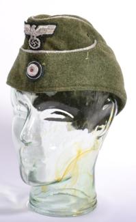 Lot 283 - A German Third Reich M38 Officer's Overseas Cap, in green/grey wool with silver metal thread...