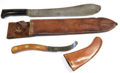 Lot 338 - A Second World War American Machete, the 37cm broad blade faintly stamped with maker's logo,...