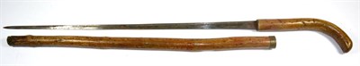 Lot 357 - A Late 19th Century Bamboo Sword Stick, the 65cm single edge steel blade with a narrow fuller...