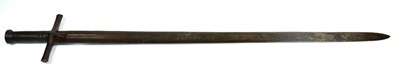 Lot 378 - A 19th Century Sudanese Kaskara, the 89cm double edge steel blade with three central narrow fullers