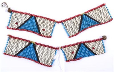 Lot 382 - A Zulu/Nguni Beadwork Necklace, made up of four rectangular panels of turquoise triangles on a...