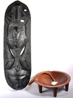 Lot 392 - A Fijian Carved Vesi Wood Tanoa (Kava) Bowl, the polished, dished top on six tapering peg supports