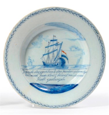 Lot 177 - A Dutch Delft Battle of Dogger Bank Commemorative Plate, circa 1781, painted in blue and orange...