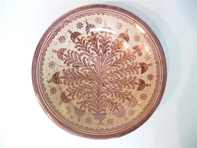 Lot 181 - An Hispano-Moresque Charger, 17th century, typically painted in copper lustre with leafy fronds...