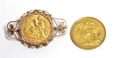 Lot 7 - An Edward VII half sovereign in frame and a Victorian 1887 sovereign