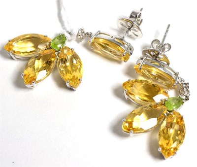 Lot 25 - A pair of citrine, peridot and diamond earrings, a marquise cut citrine suspends a cluster of three