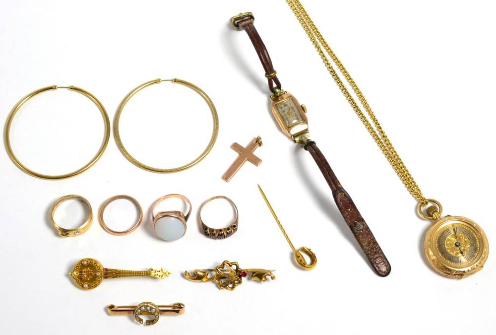 Lot 29 - A lady's fob watch, case stamped 14K; three brooches stamped 375, 15 and 9c; a horseshoe stick...