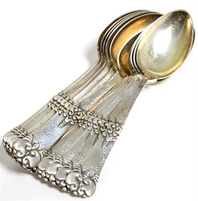 Lot 31 - A set of twelve Scandinavian metalware table spoons, stamped Sorensen 925, with spot hammered...