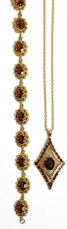 Lot 48 - A 9 carat gold garnet bracelet, length 18.5cm and a garnet pendant on chain, 29.4g gross