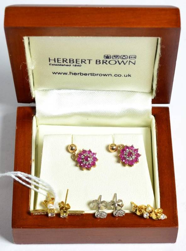 Lot 60 - A pair of diamond earrings, round brilliant cut diamonds above channel set diamond bars, total...