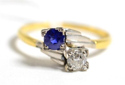 Lot 64 - An Art Deco sapphire and diamond two stone crossover ring,l estimated diamond weight 0.20 carat...