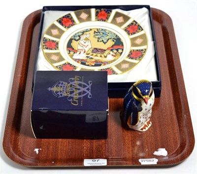 Lot 87 - A Royal Crown Derby Thistle Donkey limited edition plate, boxed; and a penguin paperweight (2)