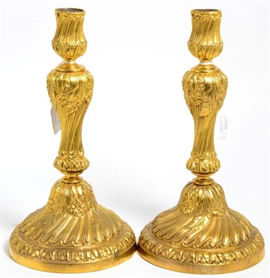 Lot 88 - A Pair of Gilt Bronze Candlesticks, in rococo style, with wrythen fluted sockets, leaf sheathed...