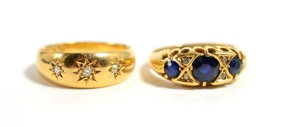 Lot 132 - An 18 carat gold star set three stone diamond ring, finger size L1/2,  3.8g and an 18 carat...