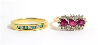 Lot 136 - A 9 carat gold ruby and diamond cluster ring, three round cut rubies within a border of round...