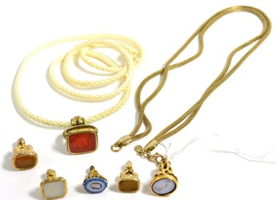 Lot 141 - A 19th century sardonyx intaglio seal, with knot motif mount, on a gilt metal chain, and five other