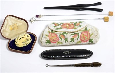 Lot 154 - A beaded evening bag; glove stretchers; a glasses case; button hook; late Victorian carved...